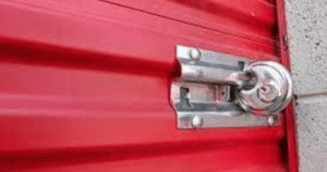 Red metal door with a silver lock.