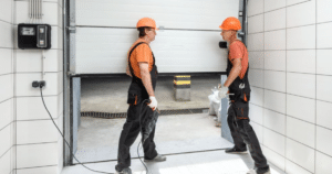 Workers installing a commercial garage door.