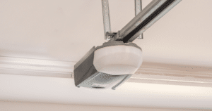 Ceiling-mounted garage door opener unit.