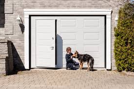 Person with dog near garage door entrance."